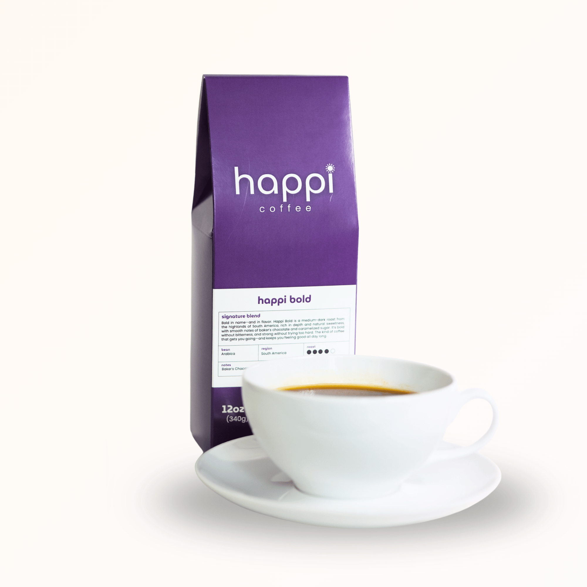 Side view of 12 oz bag of Happi Bold with cup of coffee. Best Dark Roast Coffee Beans with Baker’s Chocolate, Caramel & Deep Body, Available Ground or Whole Bean