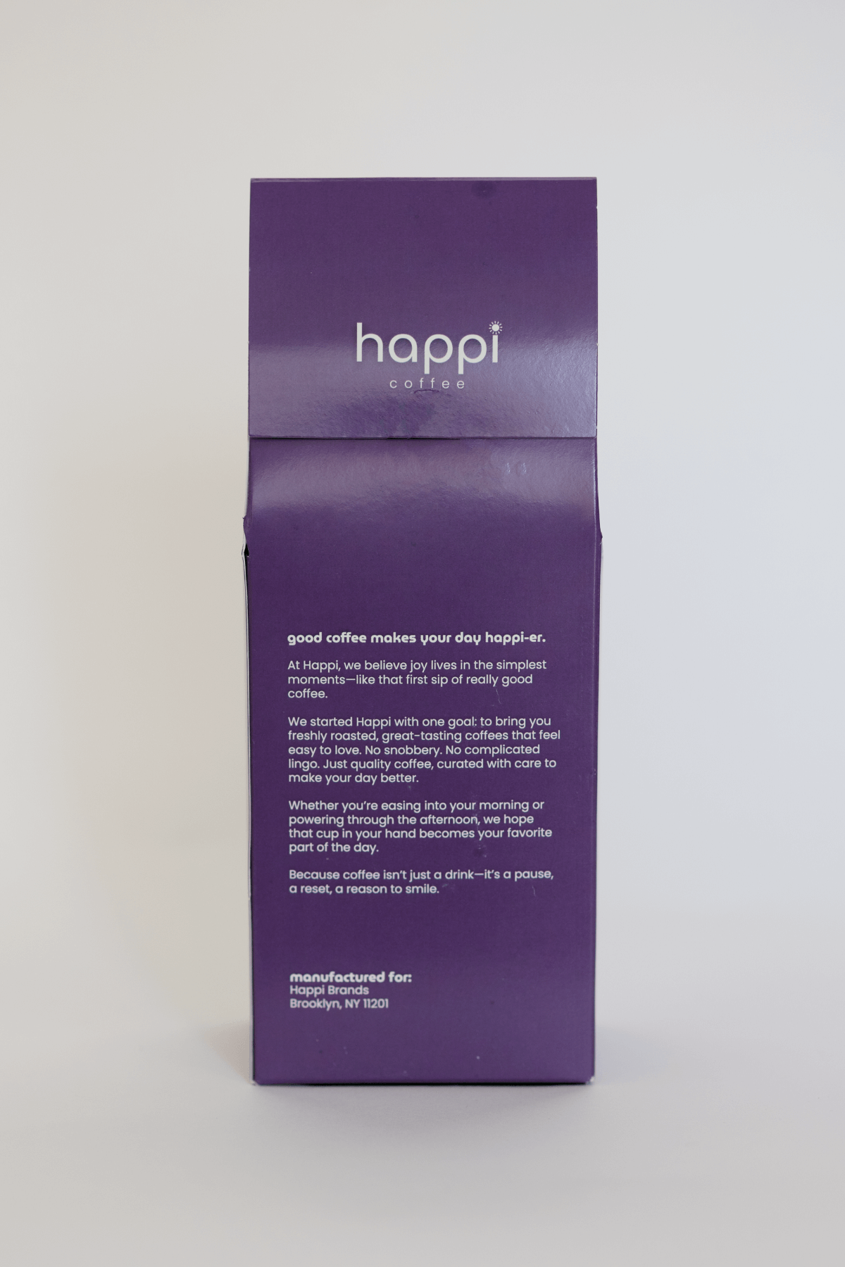 Back view of 12 oz bag of happi bold dark roast coffee – available in whole bean or ground