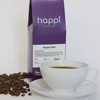 12 oz bag of happi bold dark roast specialty coffee with scattered beans and brewed coffee in white cup