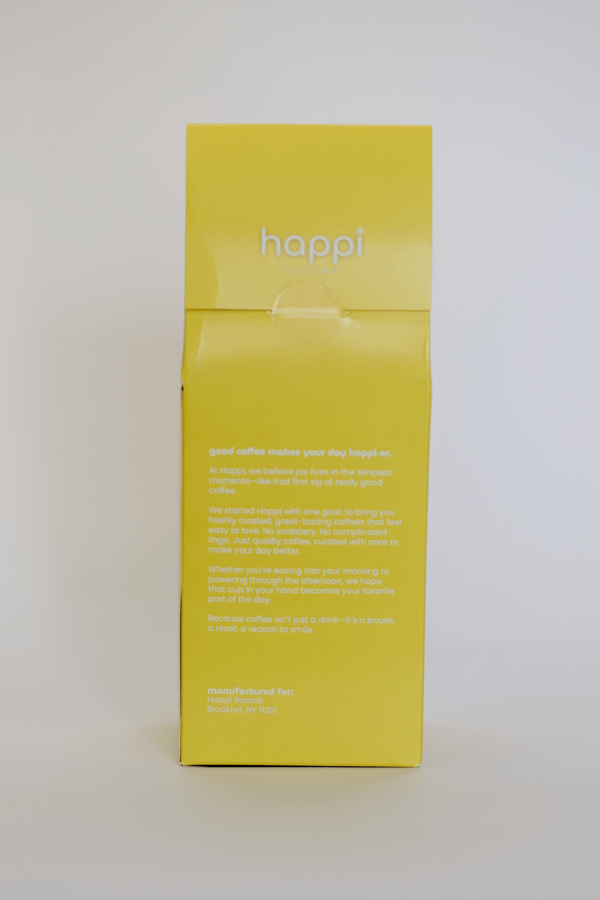 Back view of 12 oz bag of happi bright light roast coffee – available in whole bean or ground
