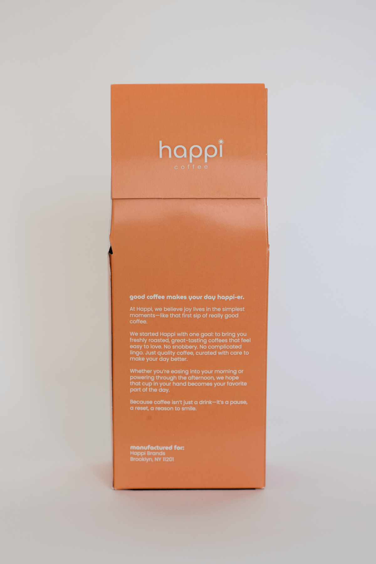 Back view of 12 oz bag of happi colombia light roast coffee – available in whole bean or ground