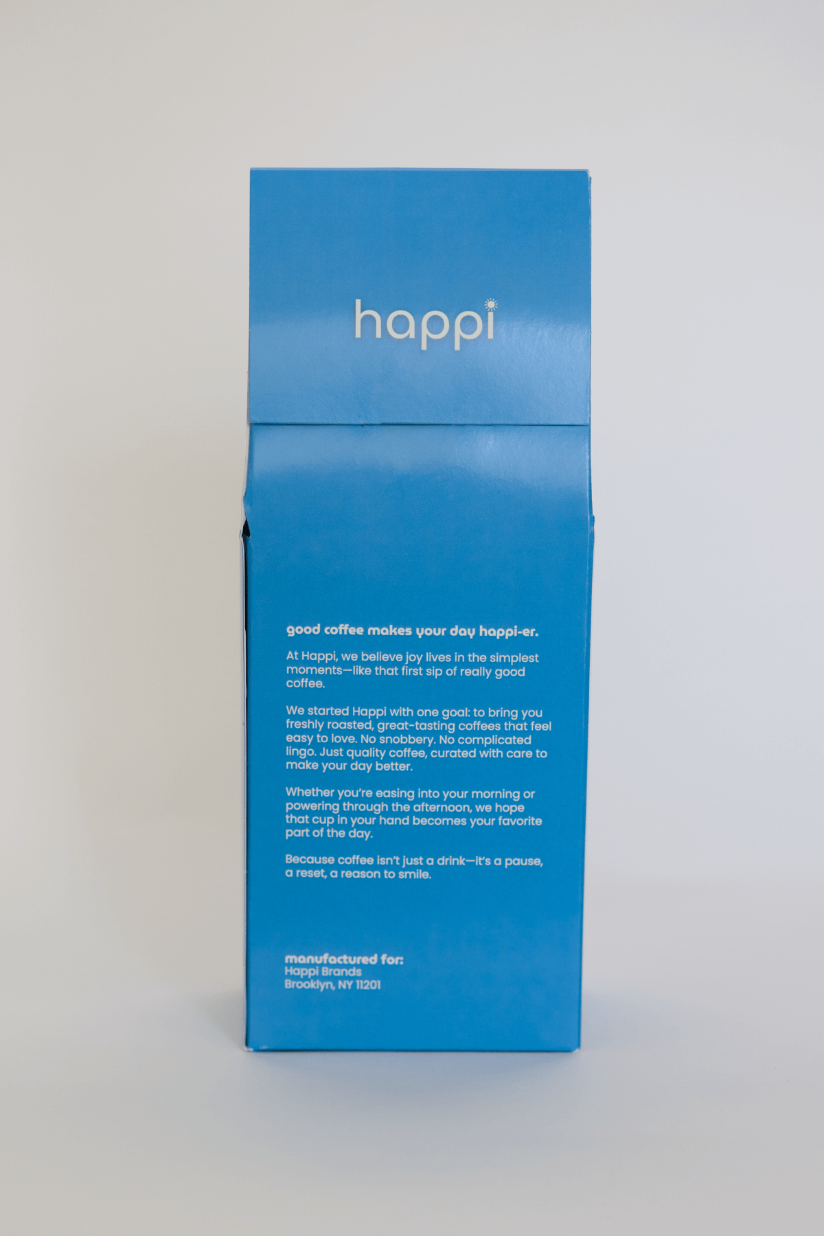 Back view of 12 oz bag of happi decaf medium roast coffee – available in whole bean or ground