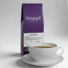 View of 12 oz bag of Happi Bold next to a cup of coffee. Best Dark Roast Coffee Beans with Baker’s Chocolate, Caramel & Deep Body, Available Ground or Whole Bean