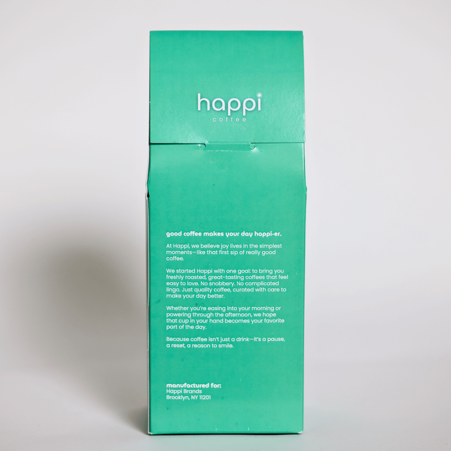 Back view of 12 oz bag of Happi Brazil. Best Medium Roast Coffee Beans with Chocolate, Almond & Toffee Notes, Available Ground or Whole Bean