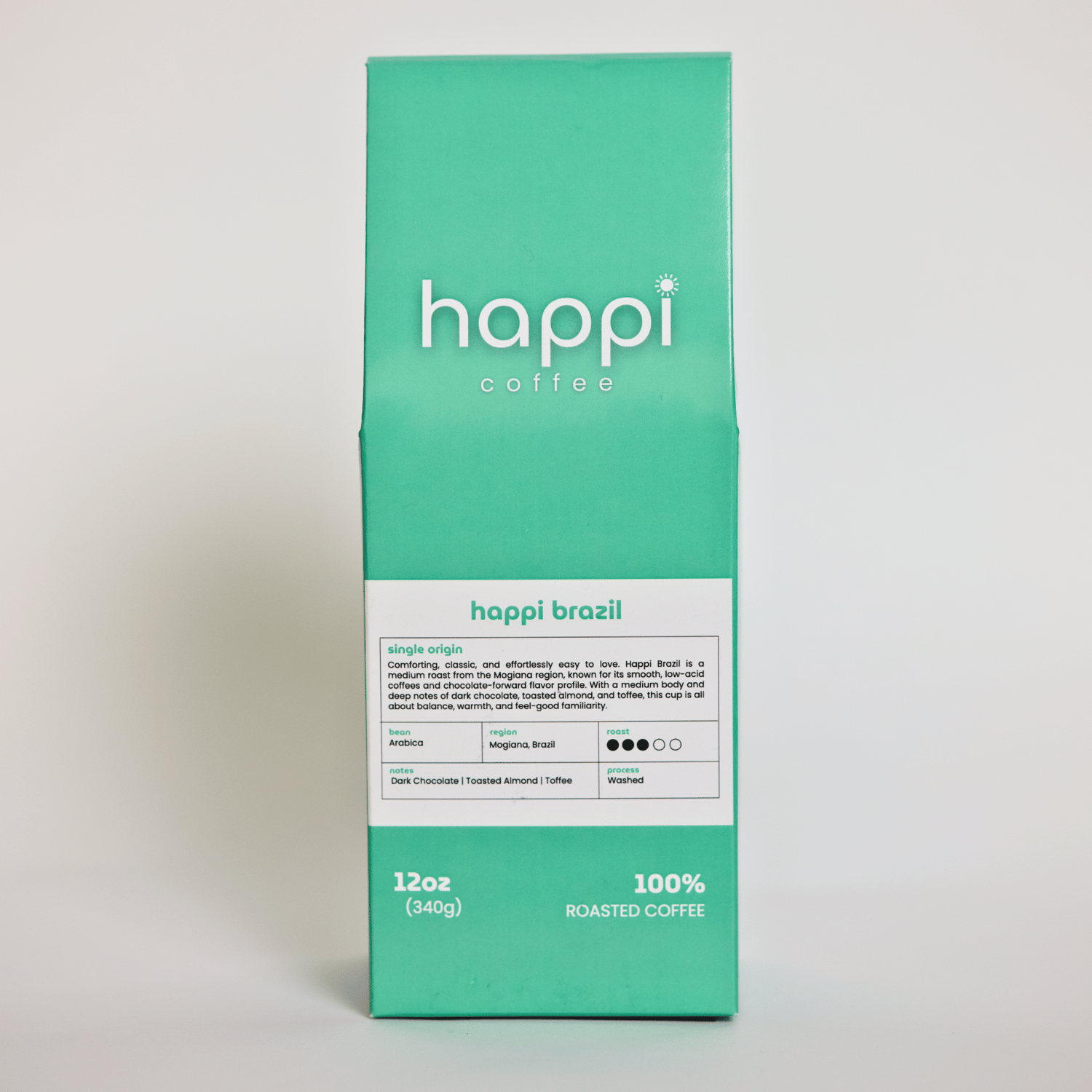 Front view of 12 oz bag of happi brazil medium roast coffee – available in whole bean or ground