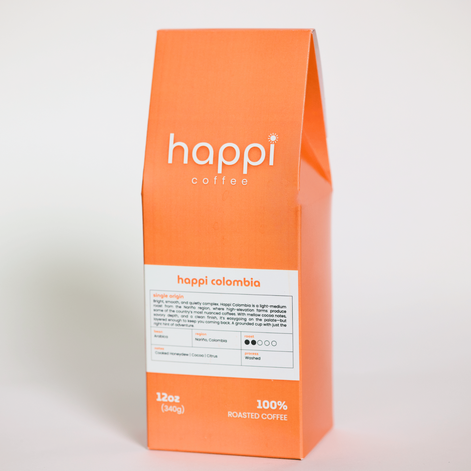 Side view of 12 oz bag of happi colombia light roast coffee – available in whole bean or ground