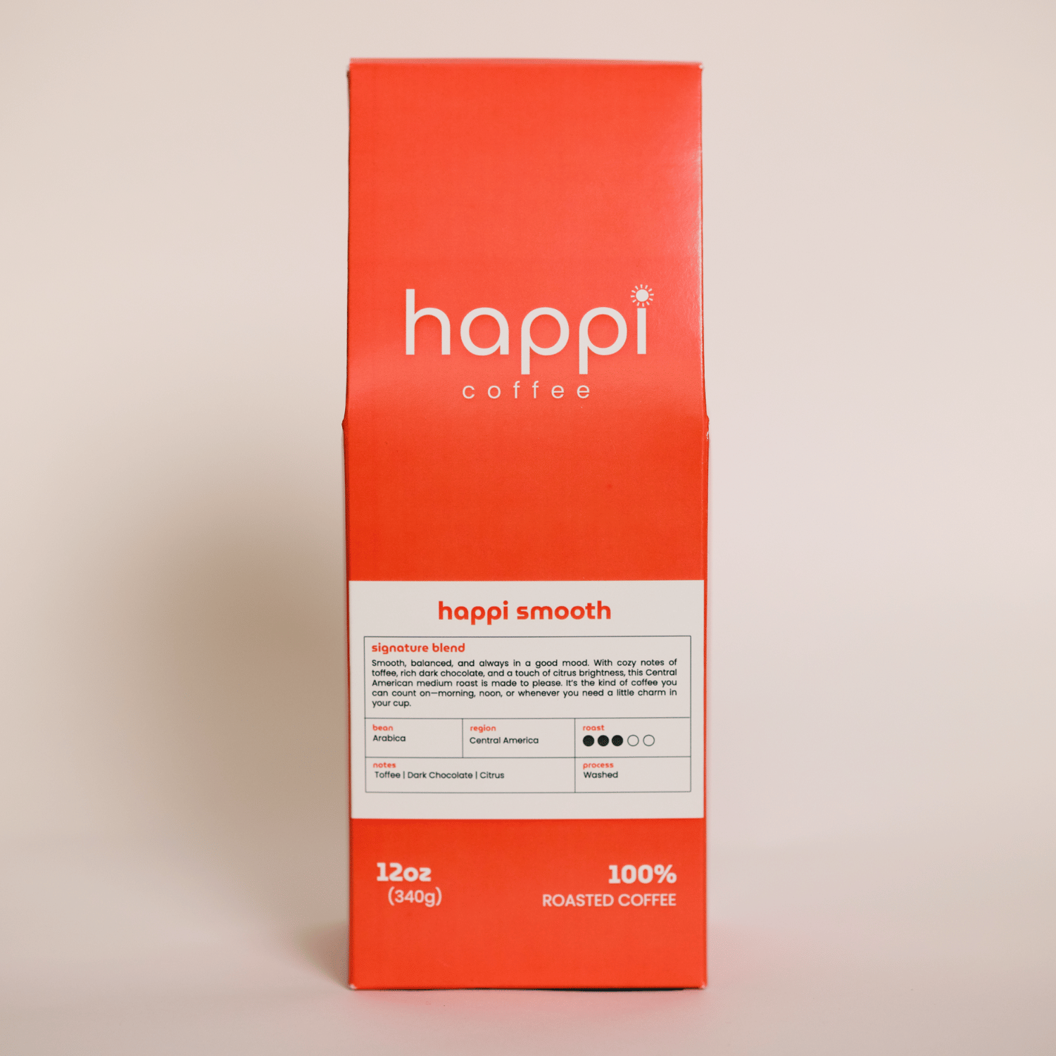 Front view of 12 oz bag of happi smooth medium roast coffee – available in whole bean or ground